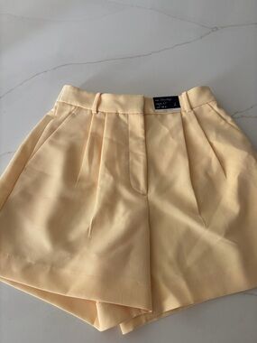 Abercrombie & Fitch Pale Yellow High-Waist Pleated Shorts